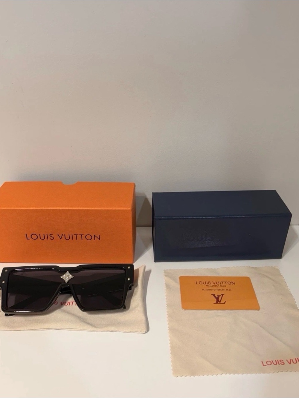 Louis Vuitton black sunglasses with silver star logo